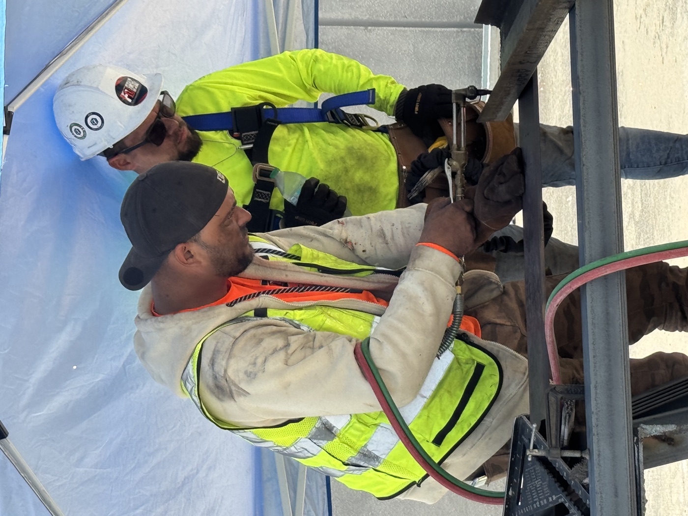 Fine Line welders working on structural steel at a jobsite